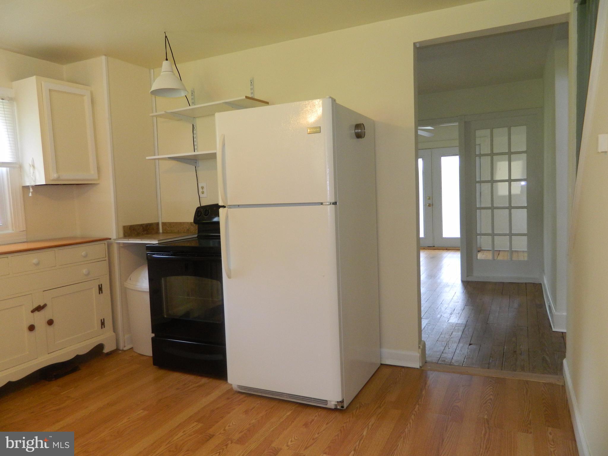 1601 Freeland Road Freeland, MD 21053 - Photo 9 of 29 a kitchen with granite countertop a refrigerator and a stove
