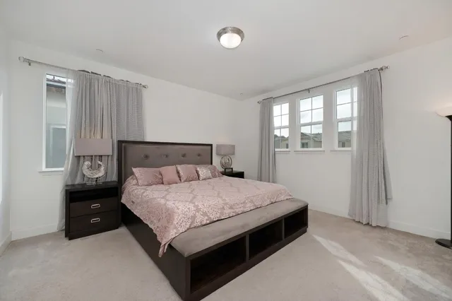 a bedroom with a bed and window