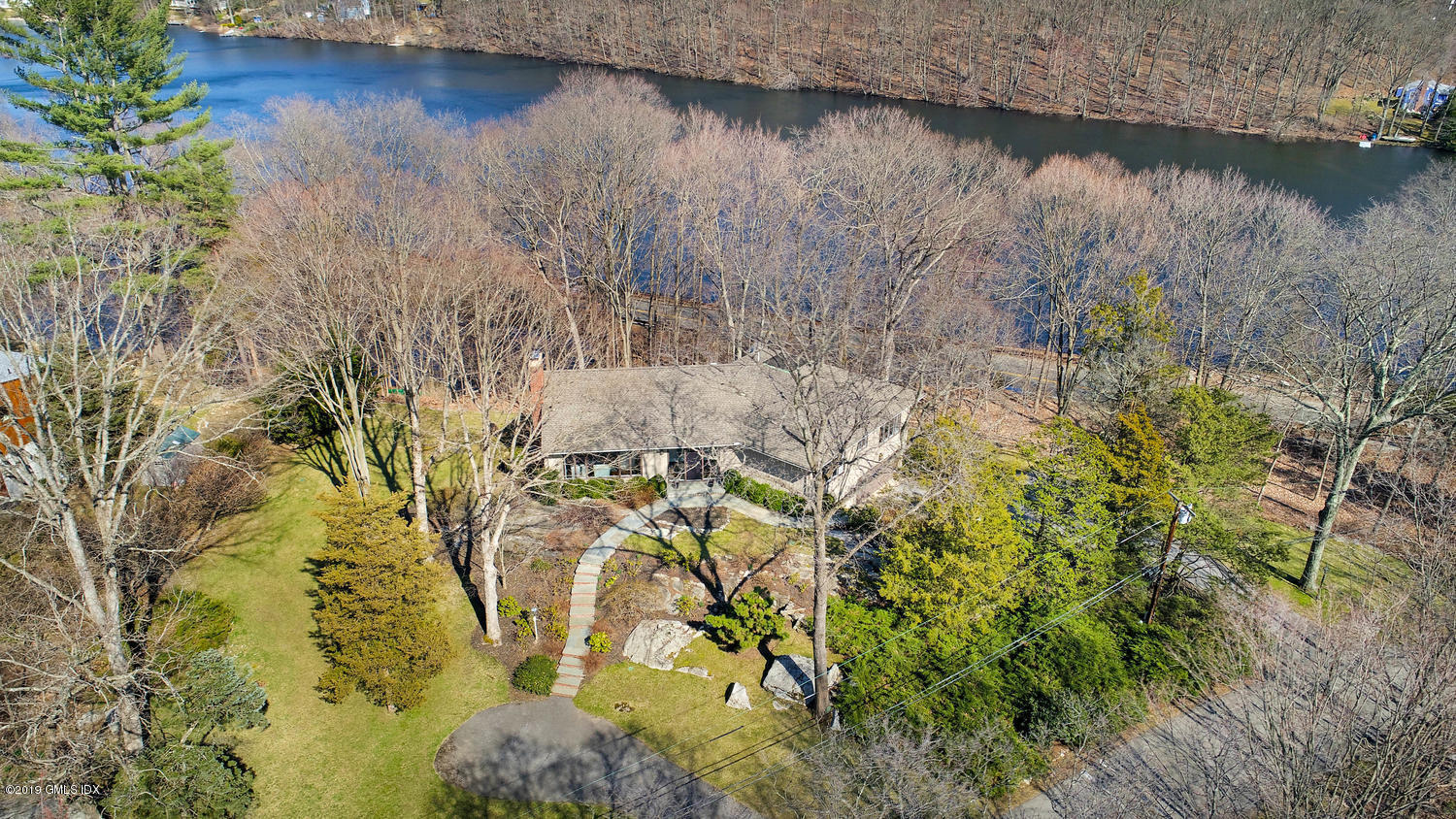 1 Lia Fail Way Cos Cob, CT 06807 - Photo 20 of 26 a view of a lake with a yard