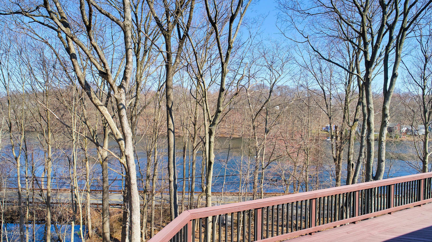 1 Lia Fail Way Cos Cob, CT 06807 - Photo 22 of 26 a balcony with trees