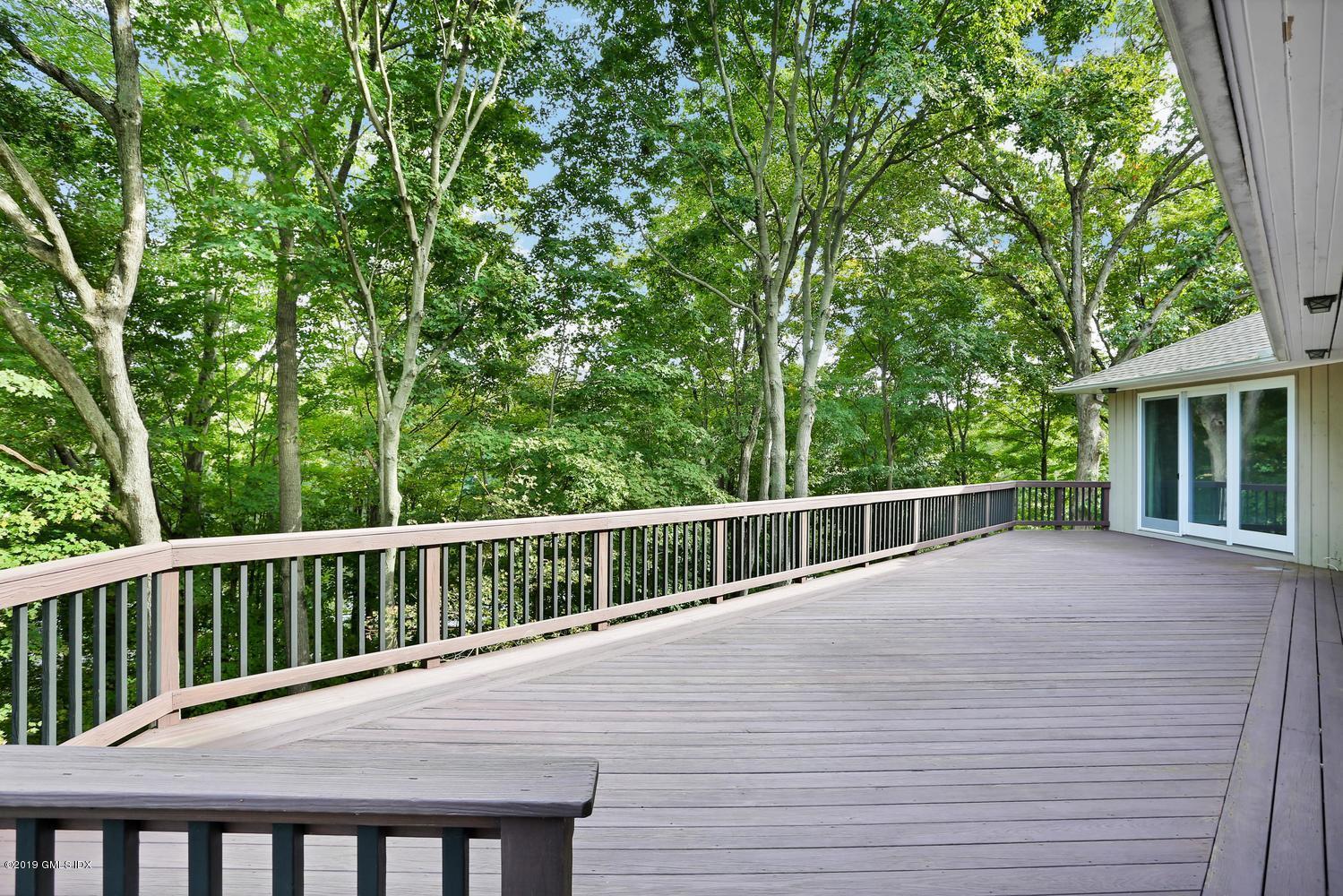 1 Lia Fail Way Cos Cob, CT 06807 - Photo 23 of 26 a view of balcony with deck and yard