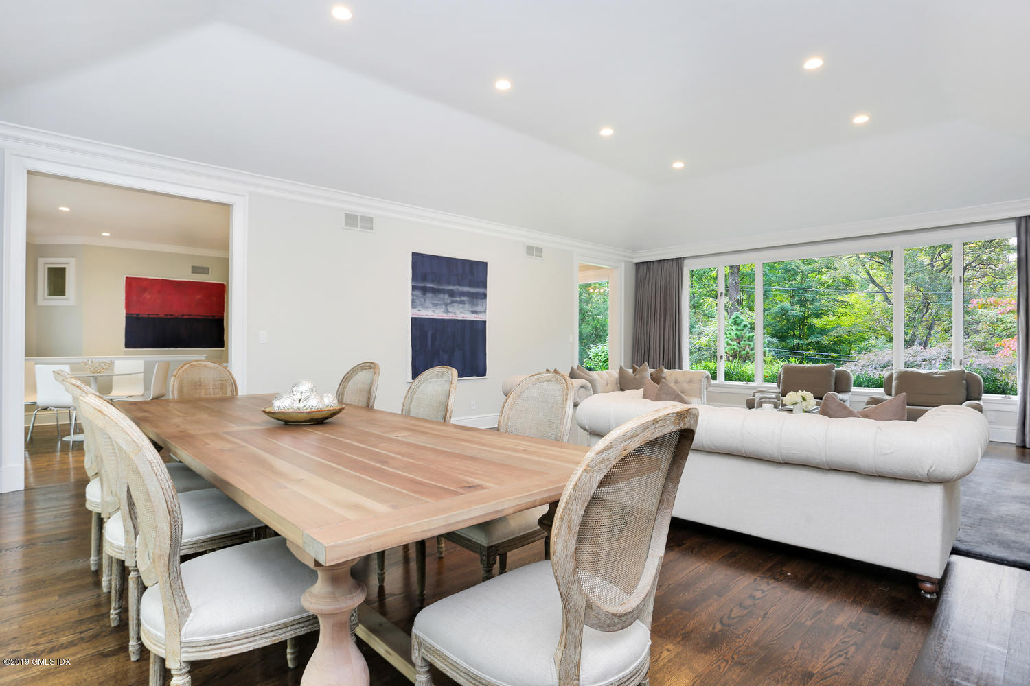 1 Lia Fail Way Cos Cob, CT 06807 - Photo 4 of 26 a view of a dining room with furniture and wooden floor