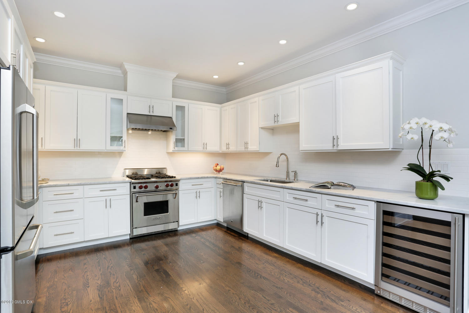 1 Lia Fail Way Cos Cob, CT 06807 - Photo 8 of 26 a kitchen with stainless steel appliances white cabinets a sink a stove a refrigerator and white cabinets