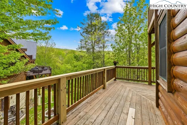 a view of balcony with wooden floor