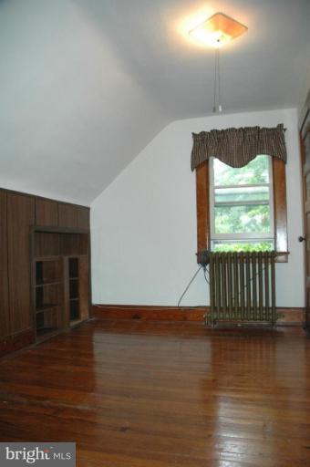 624 North Bend Road Baltimore, MD 21229 - Photo 13 of 22 an empty room with wooden floor and windows