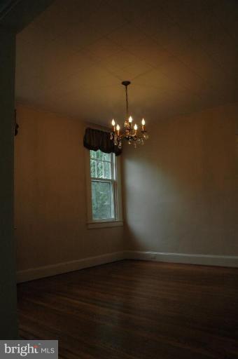 624 North Bend Road Baltimore, MD 21229 - Photo 4 of 22 a view of wooden floor and a chandelier in a room