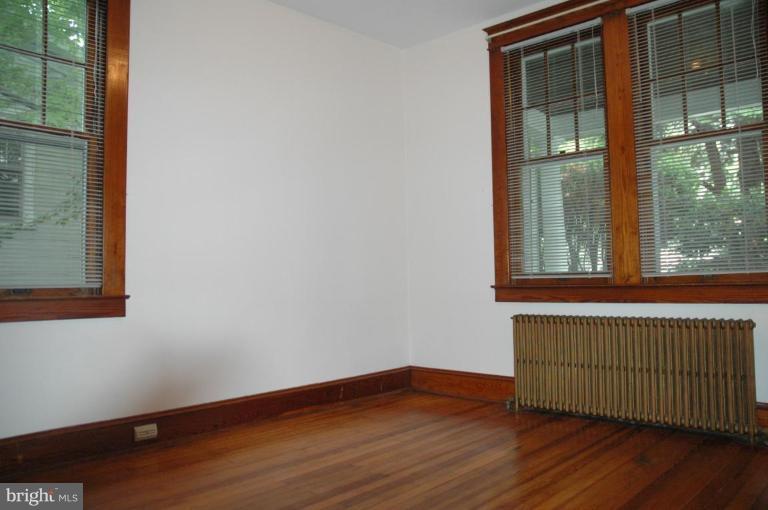 624 North Bend Road Baltimore, MD 21229 - Photo 8 of 22 a view of empty room with wooden floor and fan