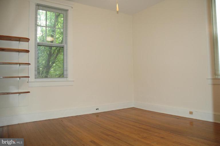 624 North Bend Road Baltimore, MD 21229 - Photo 9 of 22 an empty room with wooden floor and windows