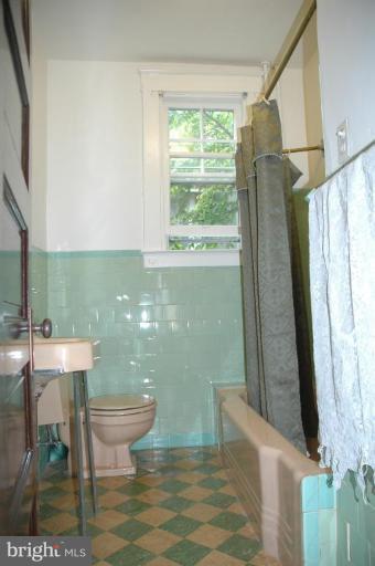 624 North Bend Road Baltimore, MD 21229 - Photo 10 of 22 a bathroom with a sink toilet and window