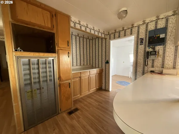 a kitchen with stainless steel appliances a refrigerator and a stove top oven