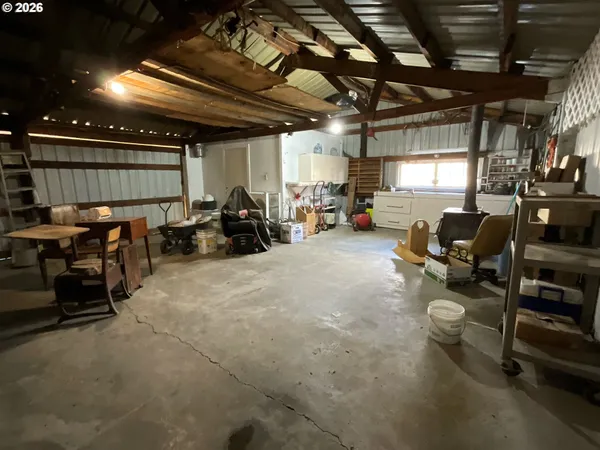 a gym room with lots of furniture and a projector screen