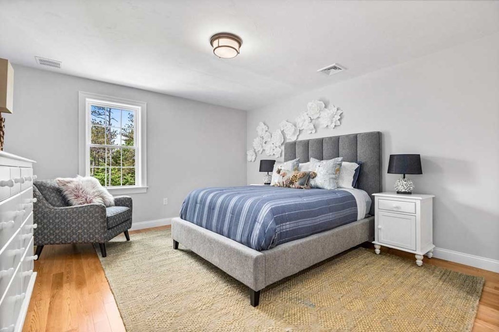 5 Preservation Way Medfield, MA 02052 - Photo 7 of 11 a bedroom with a bed and a couch