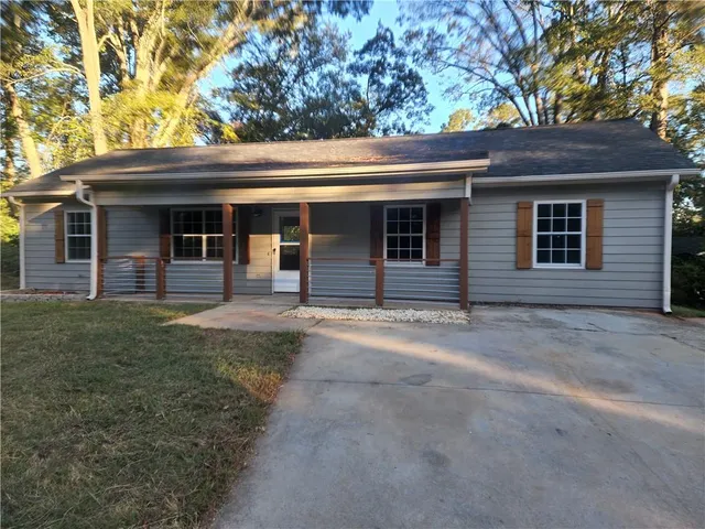 a front view of a house with garage
