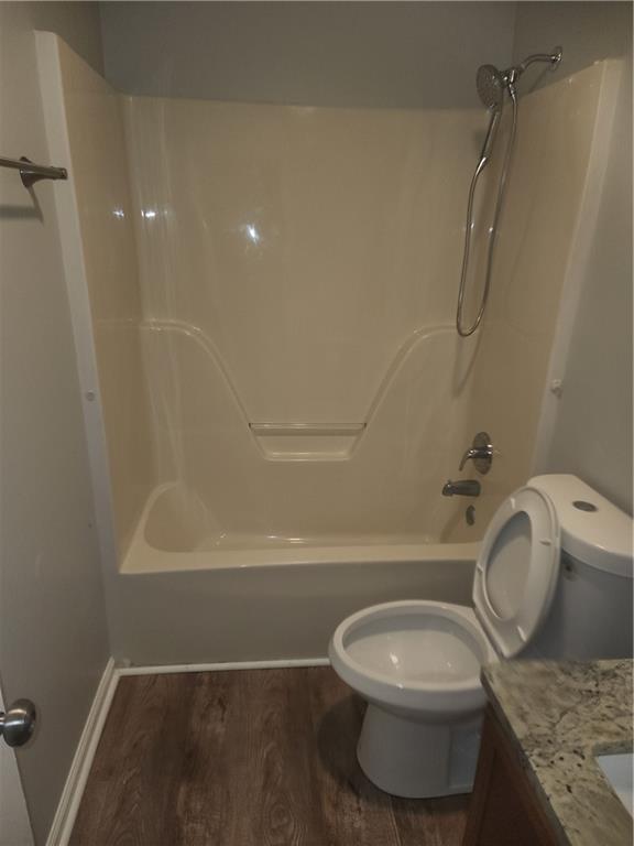 6130 Geiger Street Northwest Covington, GA 30014 - Photo 11 of 23 a white toilet sitting next to a bath tub