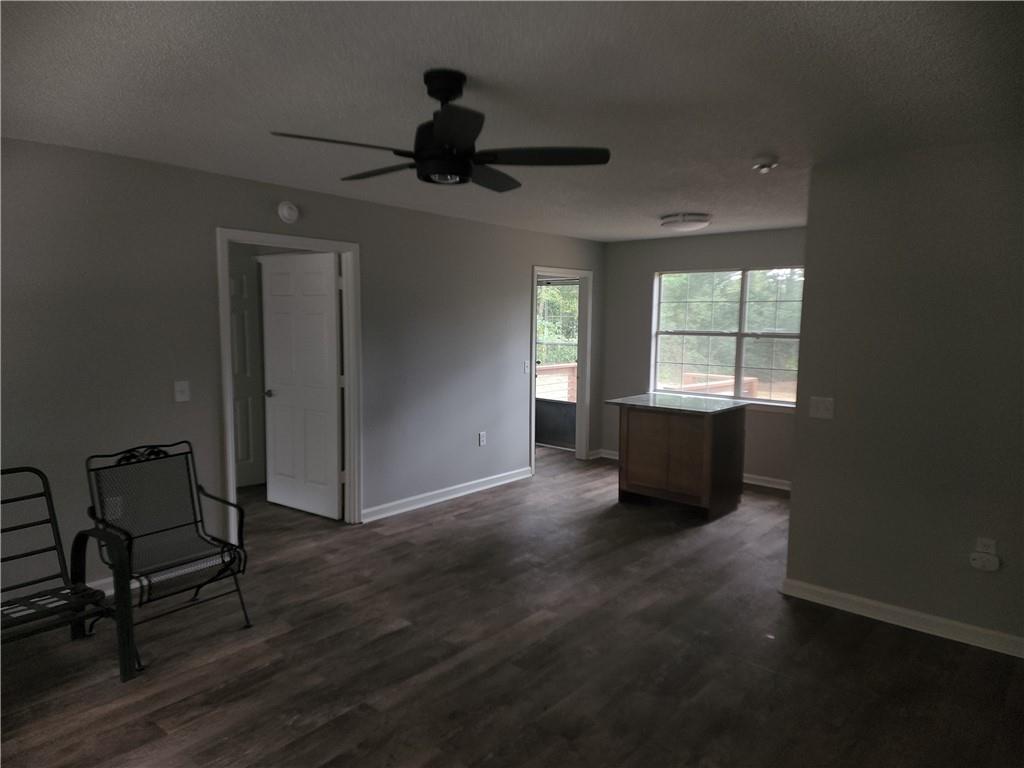 6130 Geiger Street Northwest Covington, GA 30014 - Photo 15 of 23 a view of empty room with wooden floor and fan