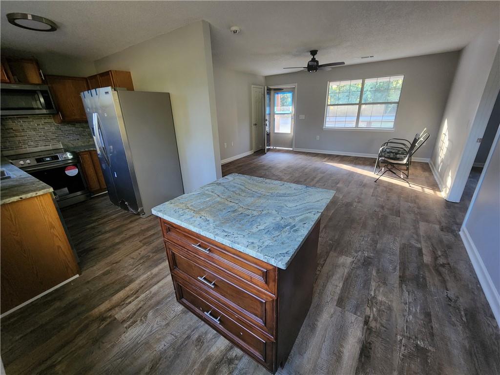 6130 Geiger Street Northwest Covington, GA 30014 - Photo 19 of 23 a view of kitchen and wooden floor
