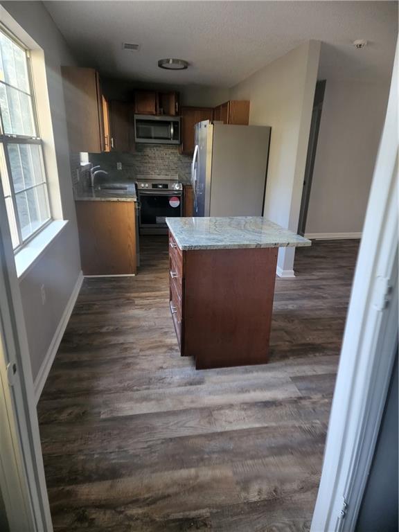 6130 Geiger Street Northwest Covington, GA 30014 - Photo 20 of 23 a view wooden floor and chair in a room