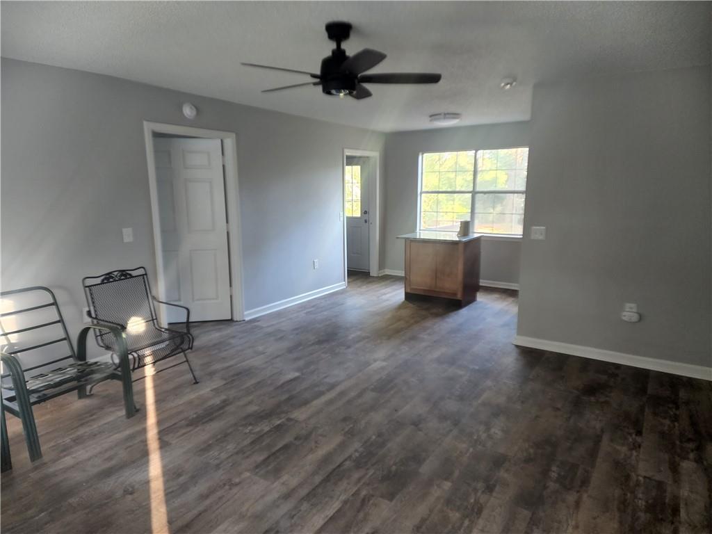 6130 Geiger Street Northwest Covington, GA 30014 - Photo 21 of 23 wooden floor and window in an empty room
