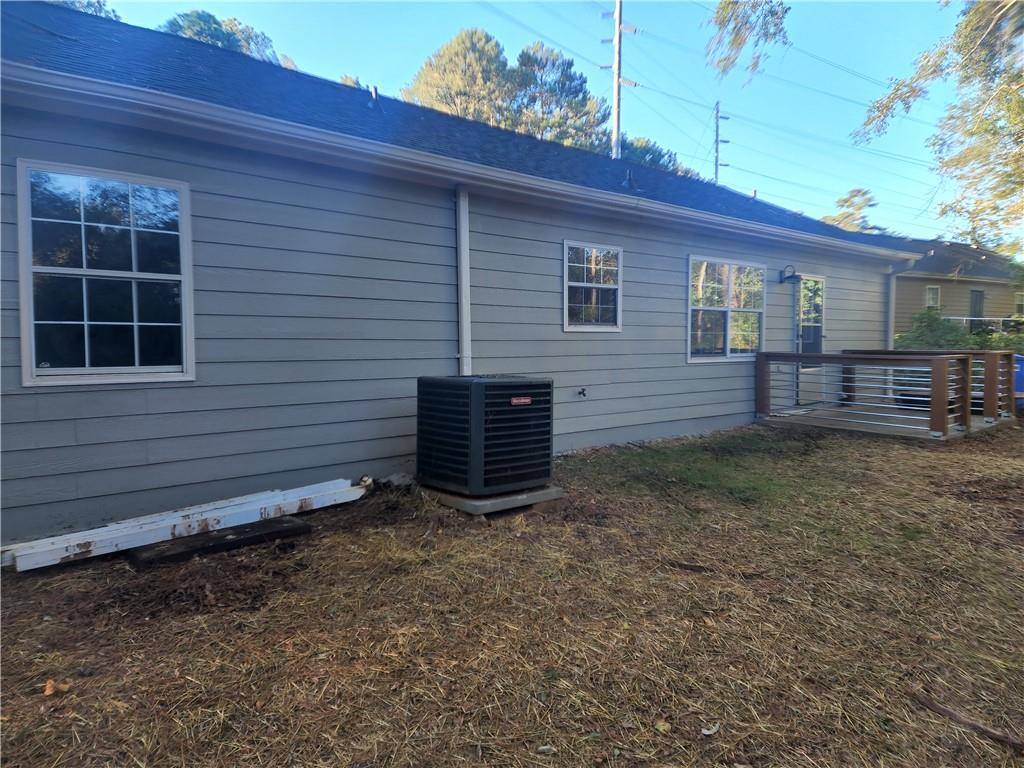 6130 Geiger Street Northwest Covington, GA 30014 - Photo 22 of 23 a view of a house with a yard and wooden fence