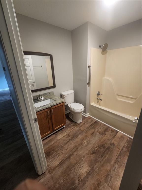 6130 Geiger Street Northwest Covington, GA 30014 - Photo 7 of 23 a bathroom with a sink a toilet and shower