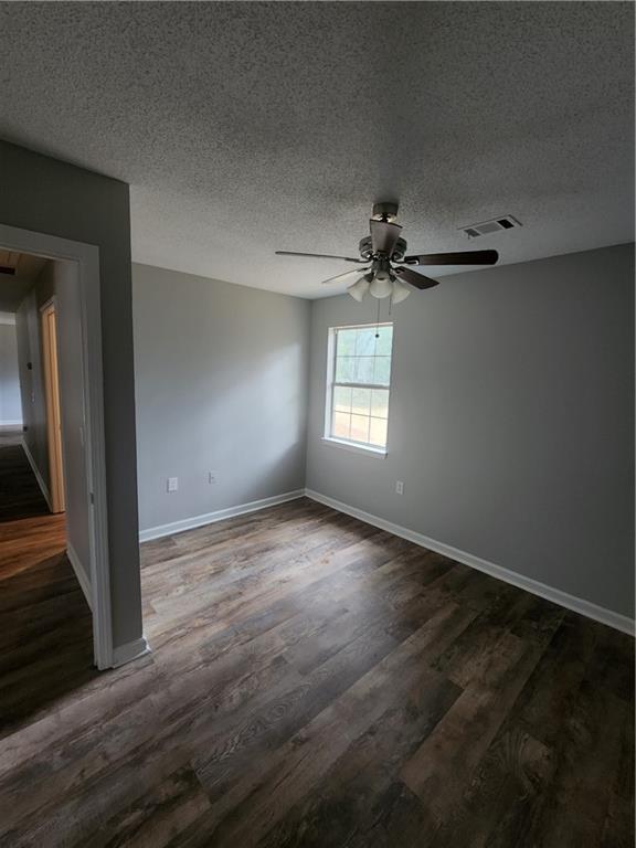 6130 Geiger Street Northwest Covington, GA 30014 - Photo 8 of 23 an empty room that has a window