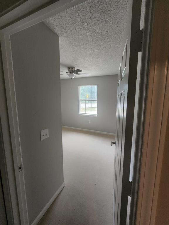 6130 Geiger Street Northwest Covington, GA 30014 - Photo 10 of 23 a view of empty room with windows