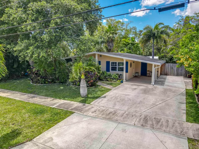 an aerial view of residential house with outdoor space