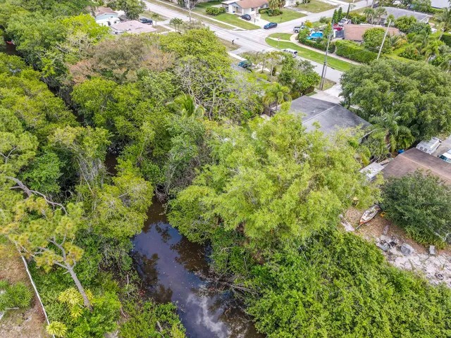 a view of a city with lawn chairs and a big yard