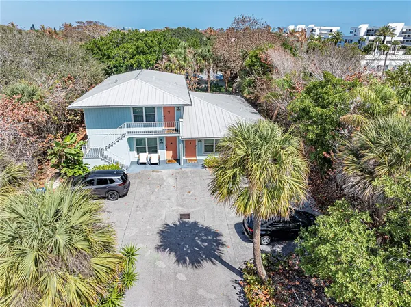 a view of a swimming pool with a table and chairs