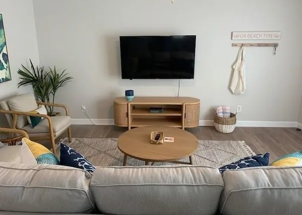 a living room with furniture and a flat screen tv
