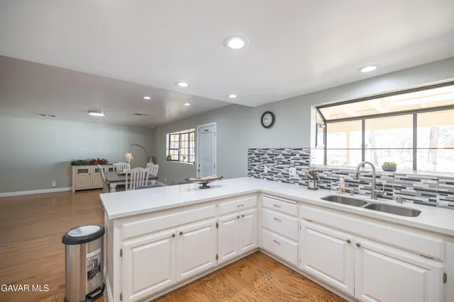 a kitchen with a sink and cabinets