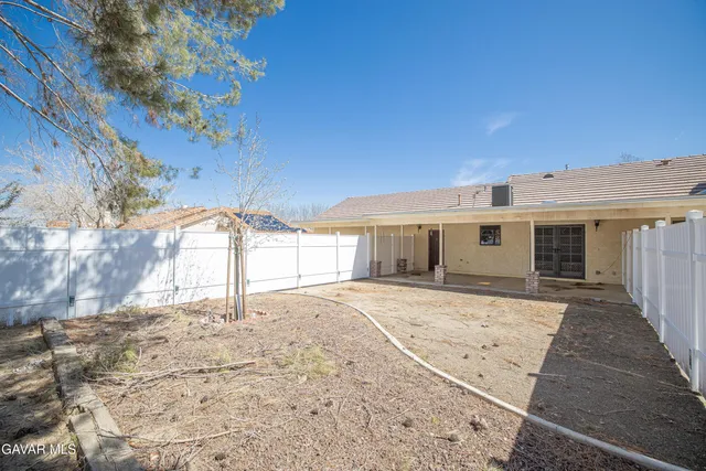 a view of a house with a snow in the yard