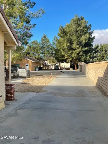 a view of street with large trees
