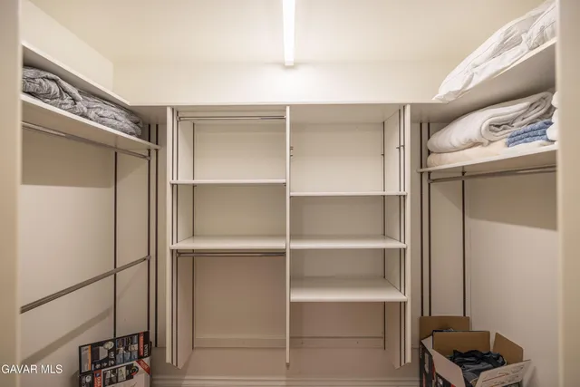 a view of a house with a yard covered in snow