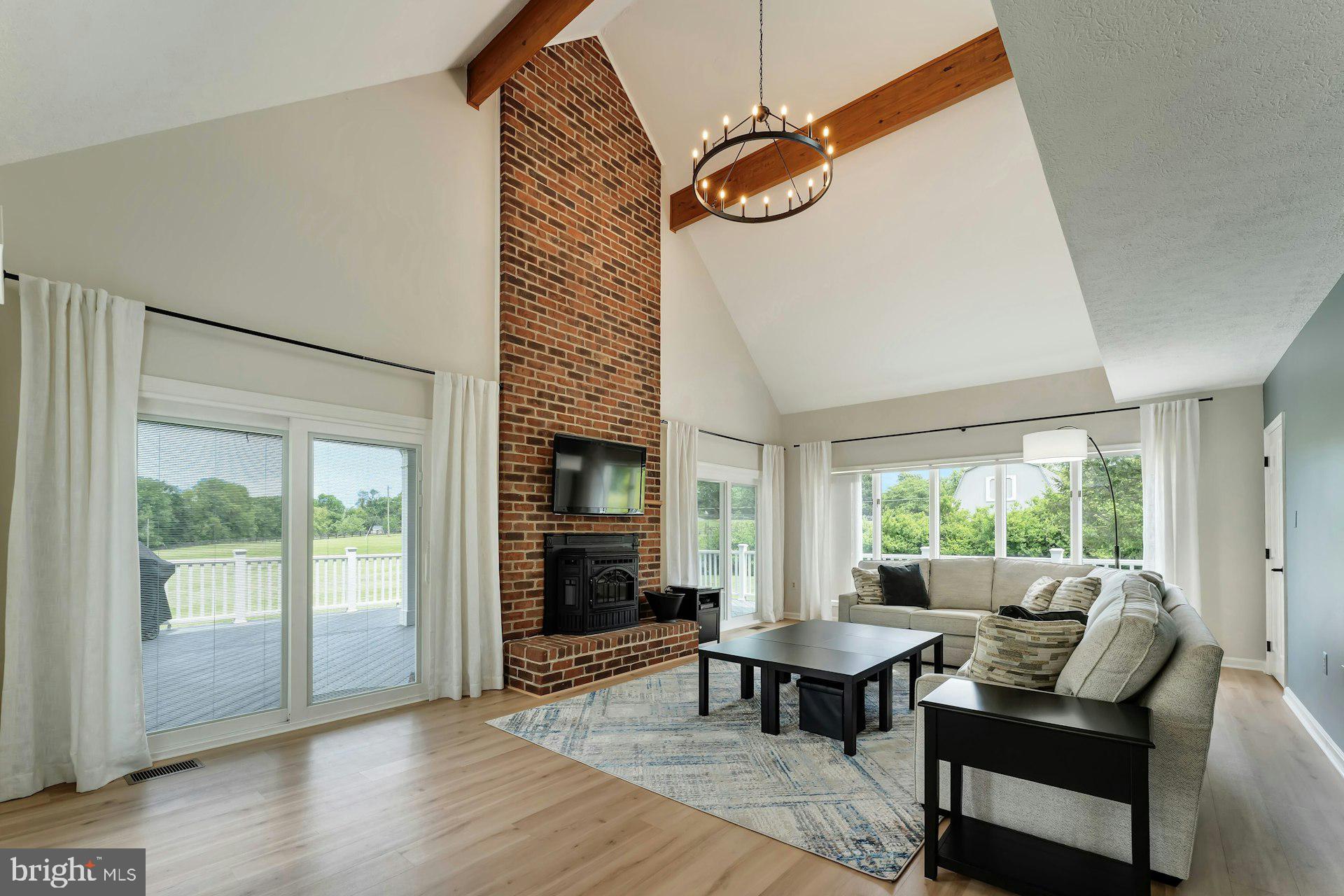 17045 Hamilton Station Road Hamilton, VA 20158 - Photo 18 of 81 Family room with brick fireplace and pellet stove
