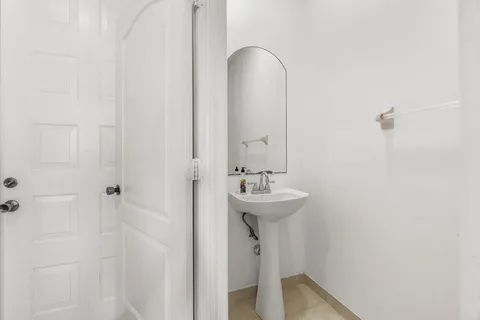 a bathroom with a sink and shower