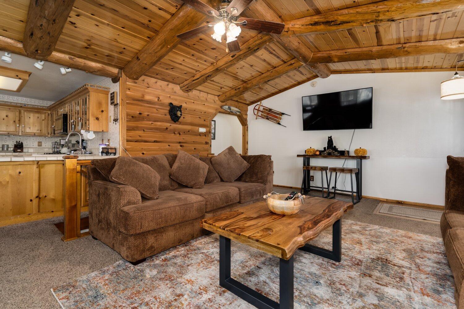 42363 Paramount Road Big Bear Lake, CA 92315 - Photo 11 of 38 a living room with furniture and a flat screen tv