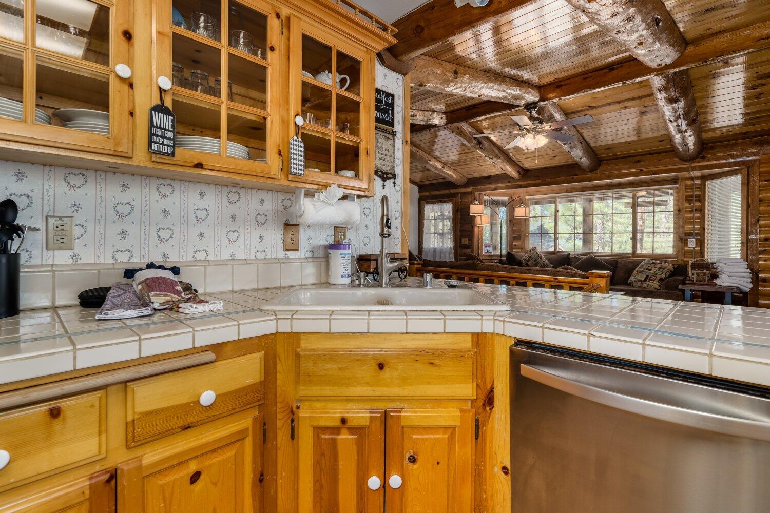 42363 Paramount Road Big Bear Lake, CA 92315 - Photo 14 of 38 a kitchen with a sink and cabinets