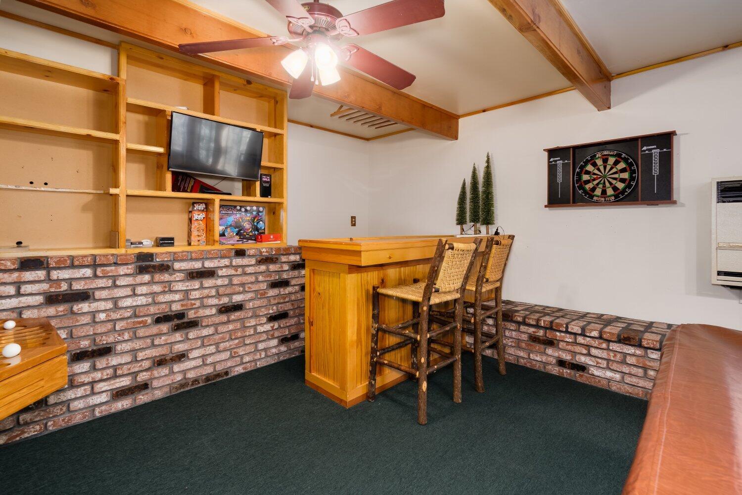 42363 Paramount Road Big Bear Lake, CA 92315 - Photo 29 of 38 a room with furniture and a flat screen tv