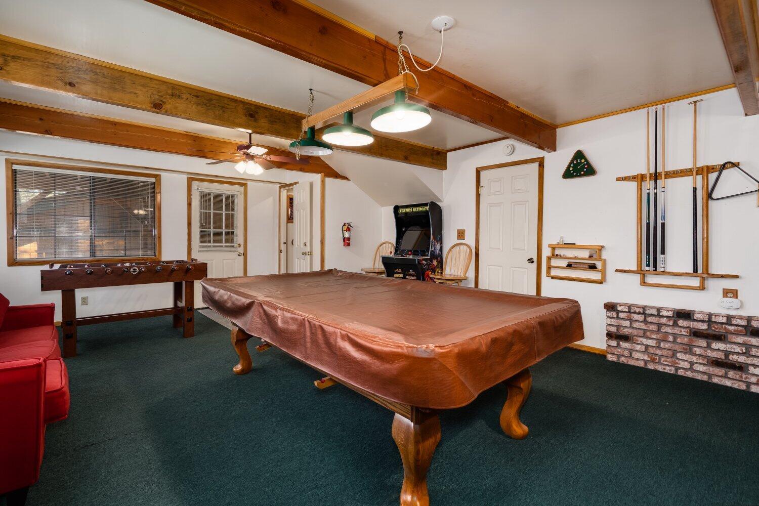 42363 Paramount Road Big Bear Lake, CA 92315 - Photo 31 of 38 a spacious bedroom with a bed table and window