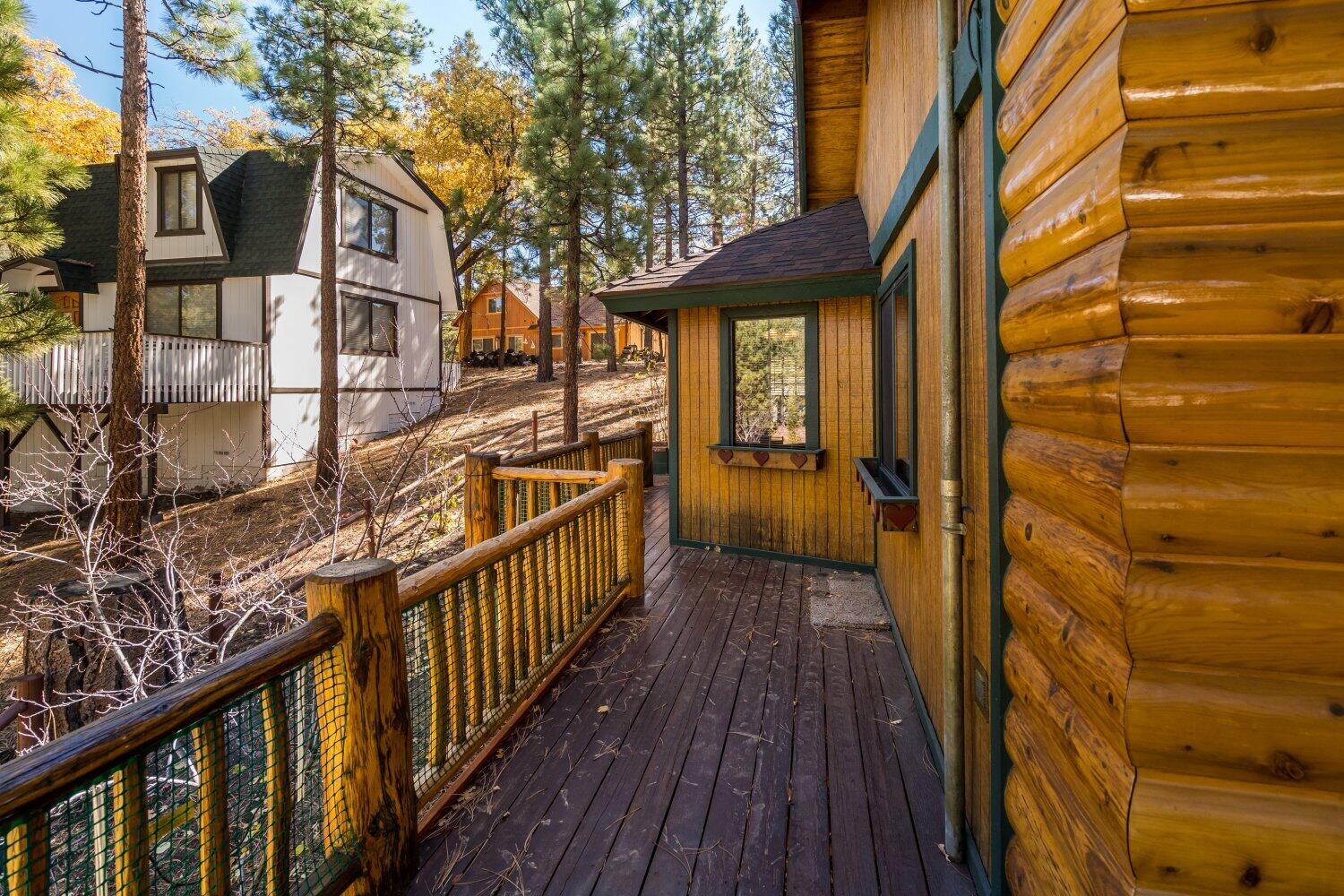 42363 Paramount Road Big Bear Lake, CA 92315 - Photo 6 of 38 a view of a house with a wooden bridge