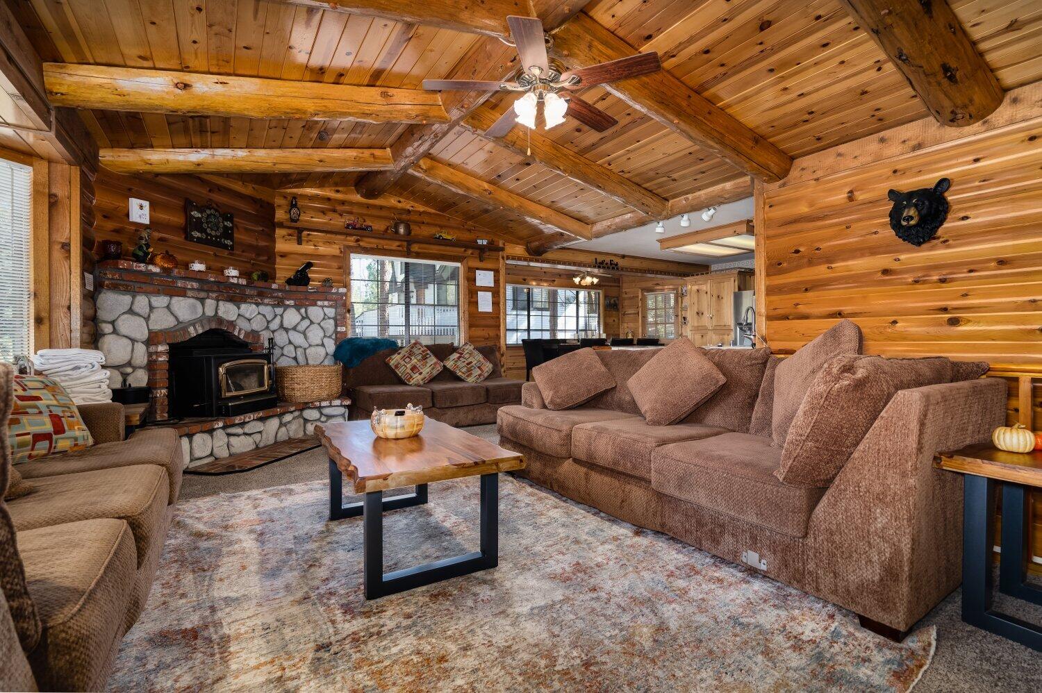 42363 Paramount Road Big Bear Lake, CA 92315 - Photo 7 of 38 a living room with furniture and a fireplace