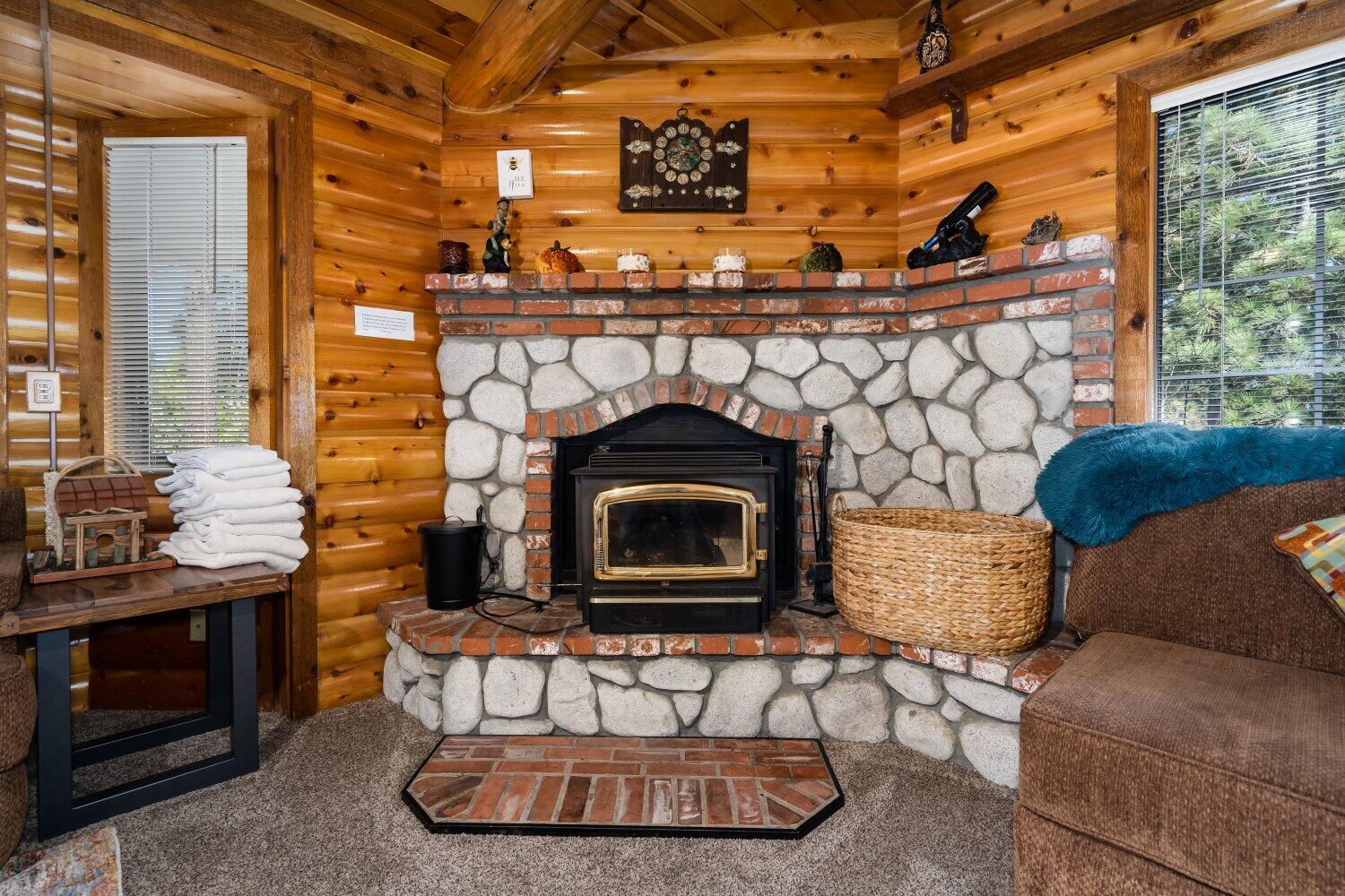 42363 Paramount Road Big Bear Lake, CA 92315 - Photo 9 of 38 a living room with a fireplace a sink and a window