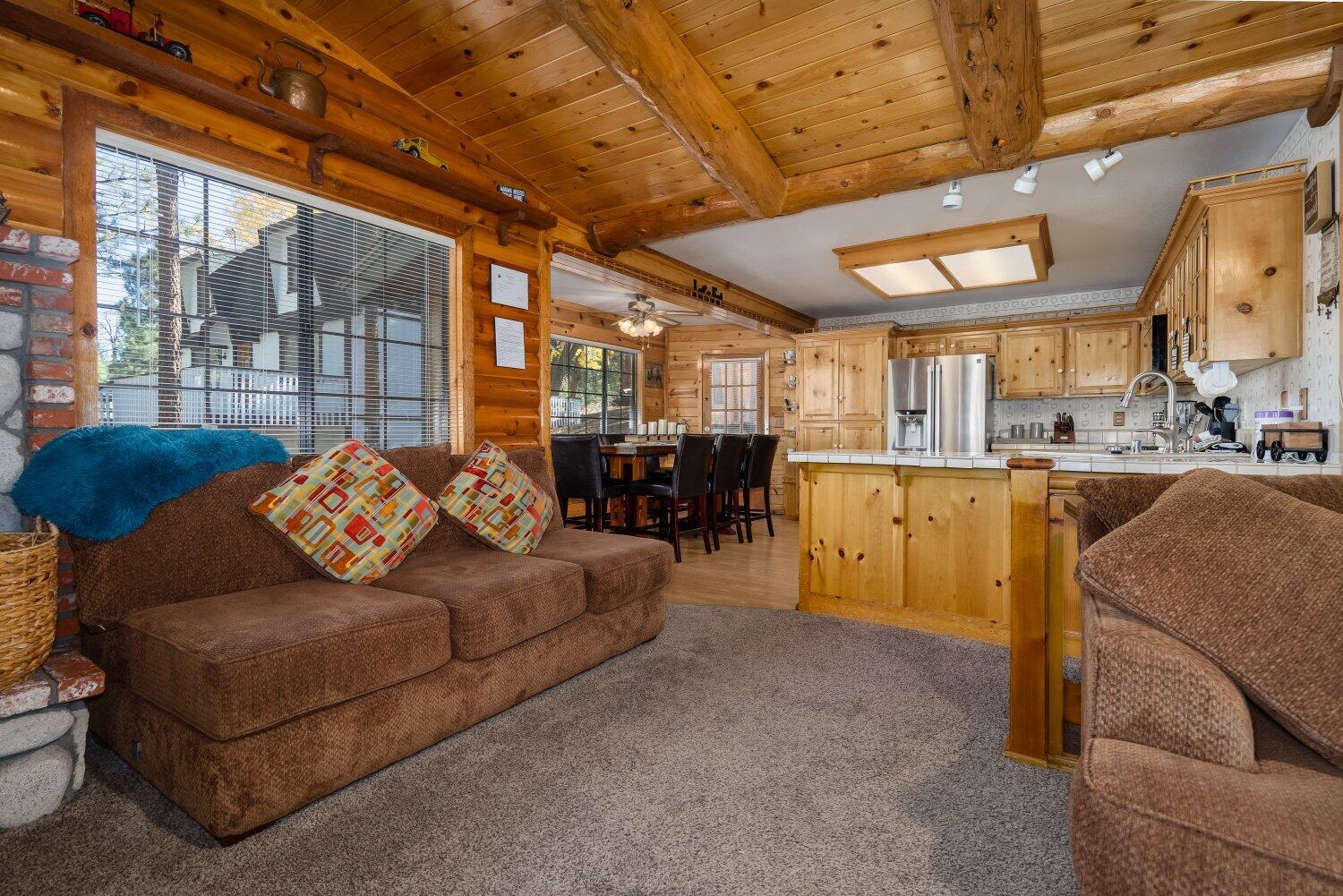 42363 Paramount Road Big Bear Lake, CA 92315 - Photo 10 of 38 a living room with furniture and a chandelier
