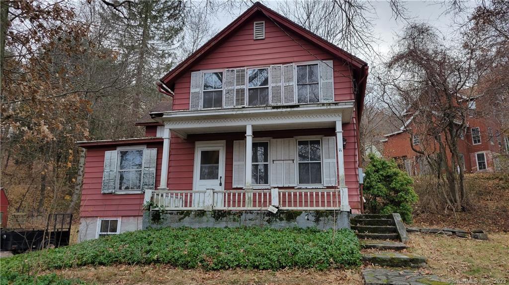 a view of a house with brick walls and large windows