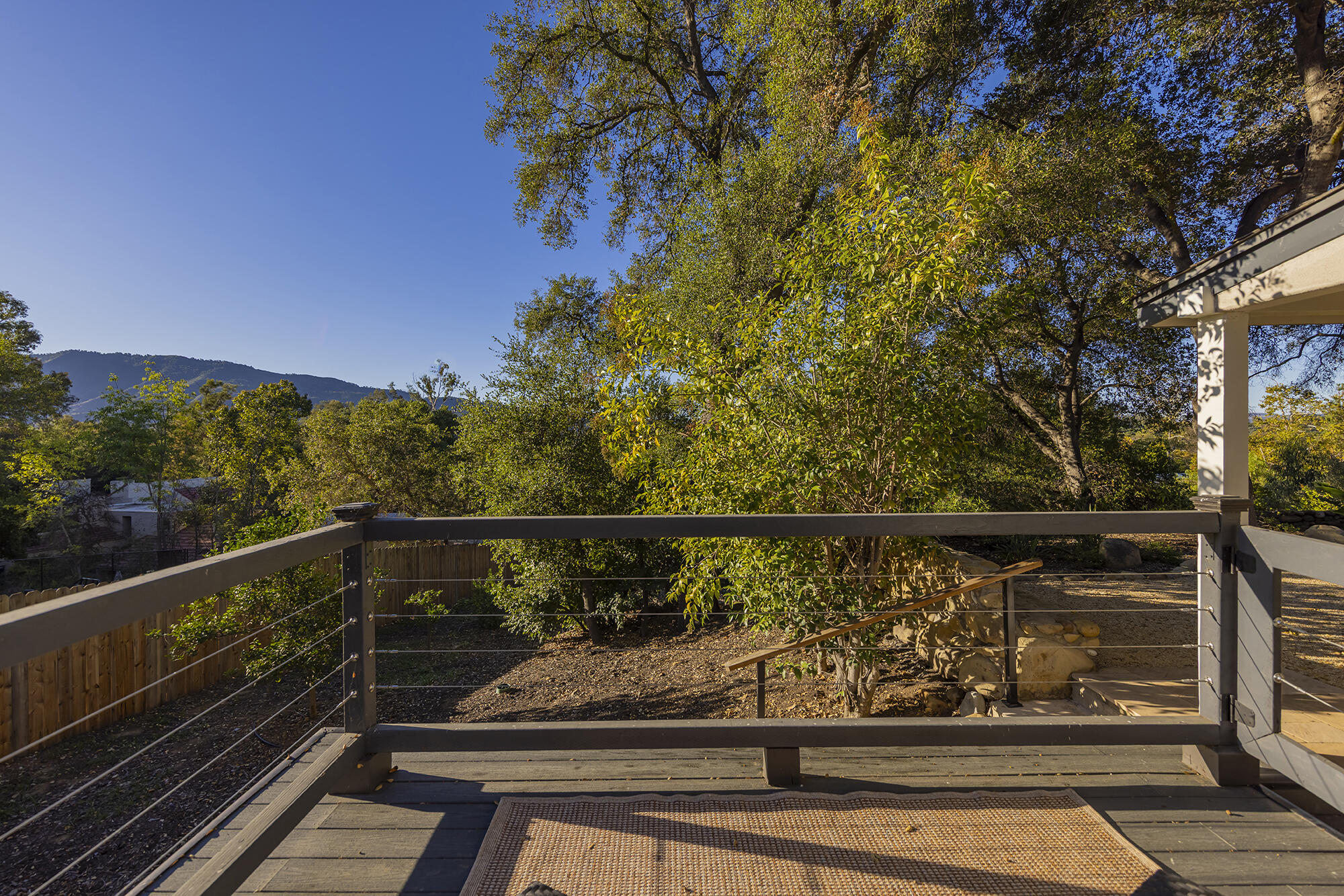1068 Cuyama Road Ojai, CA 93023 - Photo 11 of 43 a view of balcony with lots of trees and wooden fence