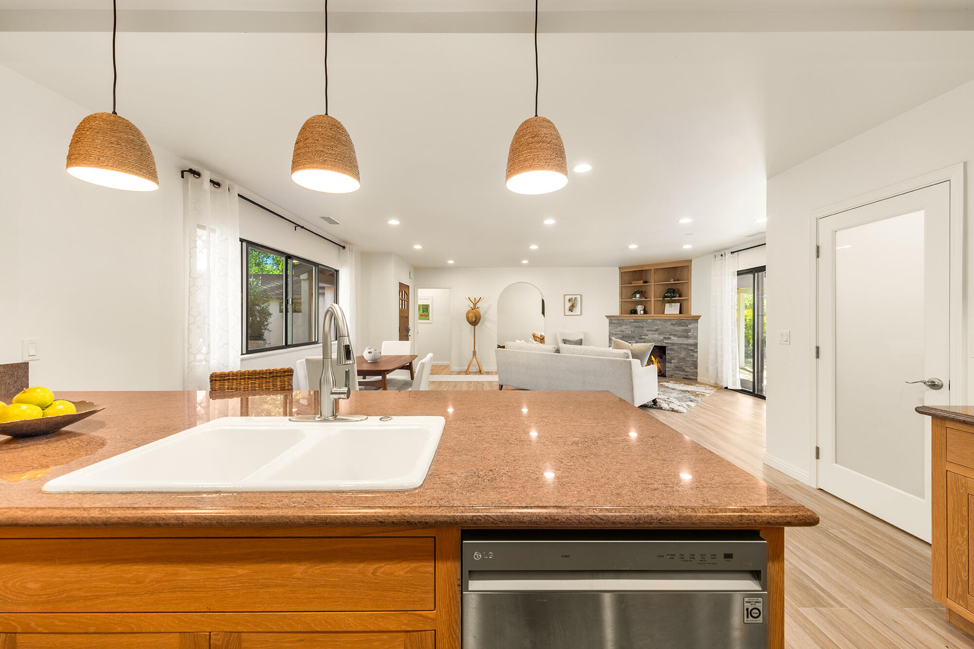 1068 Cuyama Road Ojai, CA 93023 - Photo 20 of 43 a room with kitchen island a sink and a chandelier