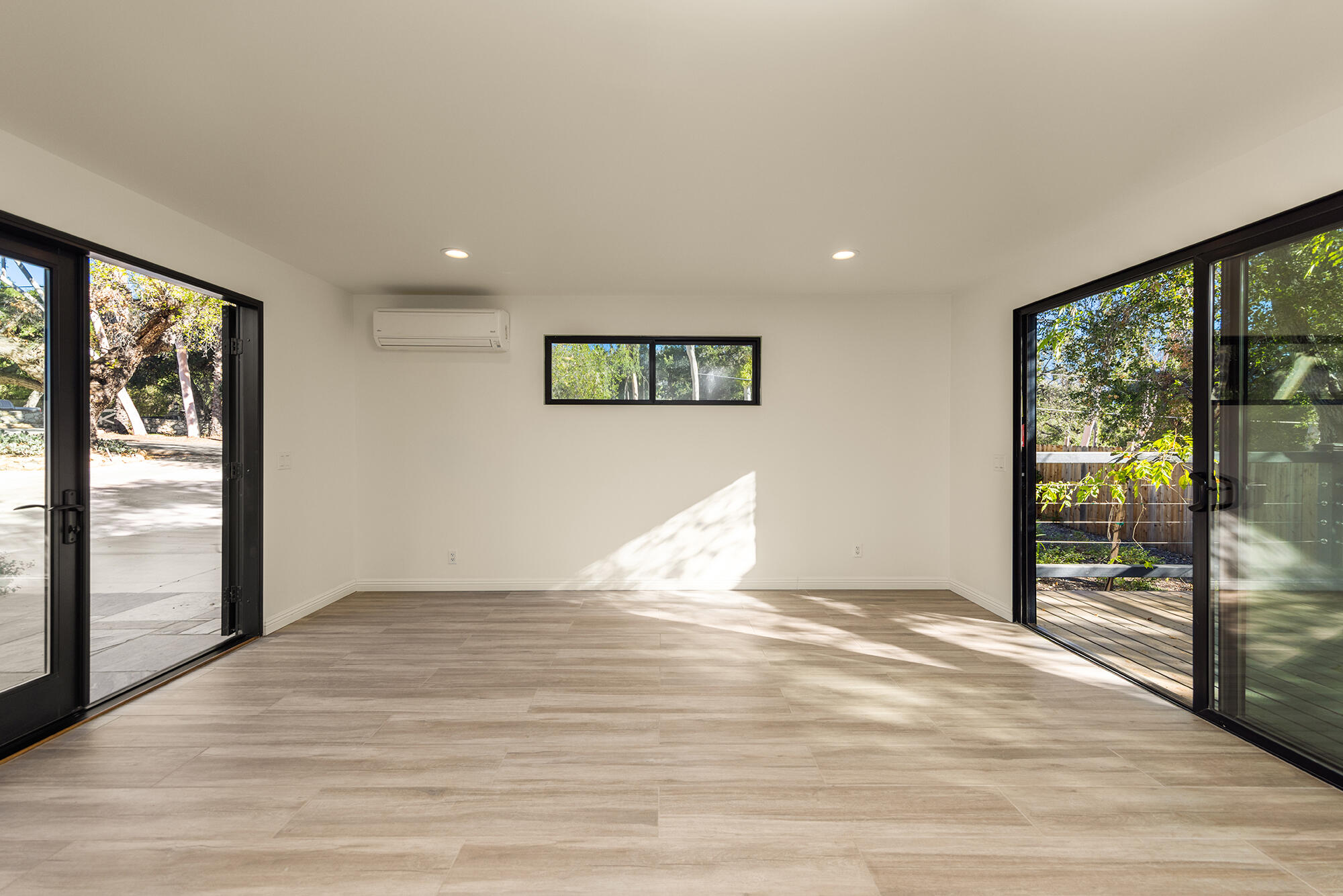 1068 Cuyama Road Ojai, CA 93023 - Photo 24 of 43 a view of an empty room with wooden floor and a window
