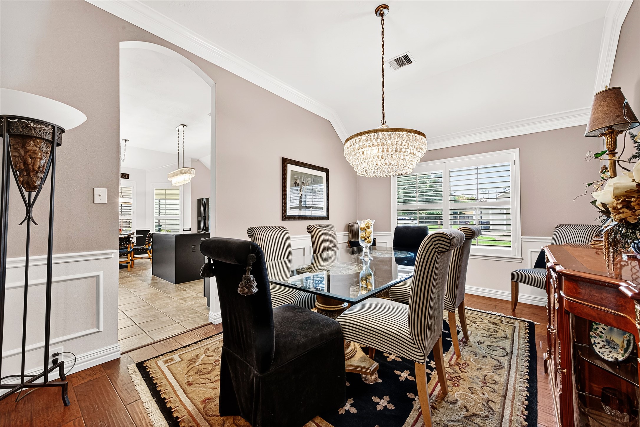 3326 River Bend Drive Rosenberg, TX 77471 - Photo 8 of 29 Stunning chandelier, 4" blinds and chair railing makes this dining room exceptional.
