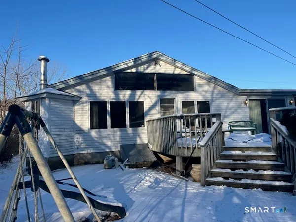 a front view of a house with deck